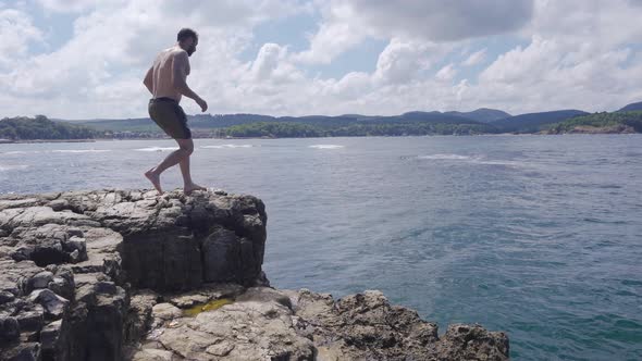 Jumping From A Rock.