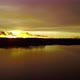 Hovering Over a Large and Big Lake at Sunset - VideoHive Item for Sale