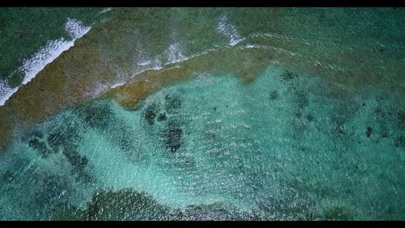 Aerial top down nature of perfect tourist beach adventure by transparent ocean with white sand backg