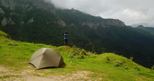 360 Degree Shot A Traveler Tourist Girl Stands By Road Camping Tent In Beautiful Landscape Of Highla