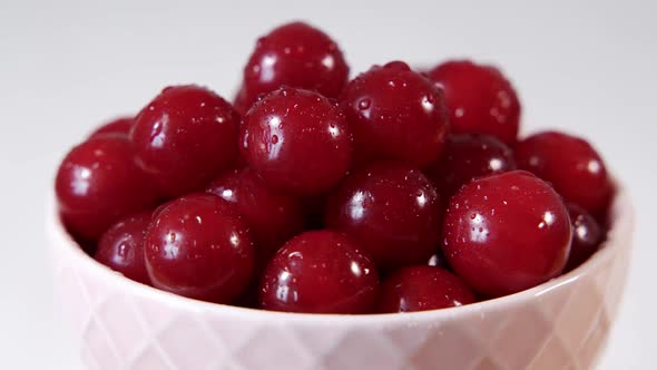 Close Up of a Cup of Fresh Cherry and Raspberry on Cutting Board