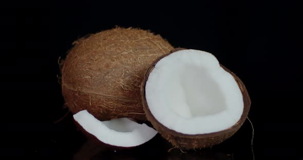 Whole and Pieces of Coconut Slowly Rotate.