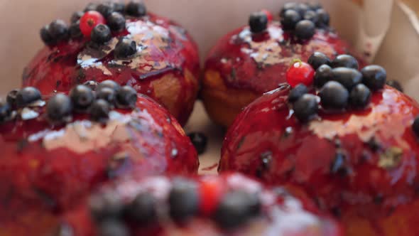 Close Up of Healthy Organic Vegan Doughnuts with Berry Sauce in a Box. Healthy Life Style Concept. 