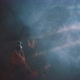 Blurry view of man recording with vintage camera surrounded by smoke - VideoHive Item for Sale