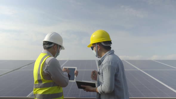 The Engineer And Worker Working Together In The Solar Panel Power Station Renewable Energy