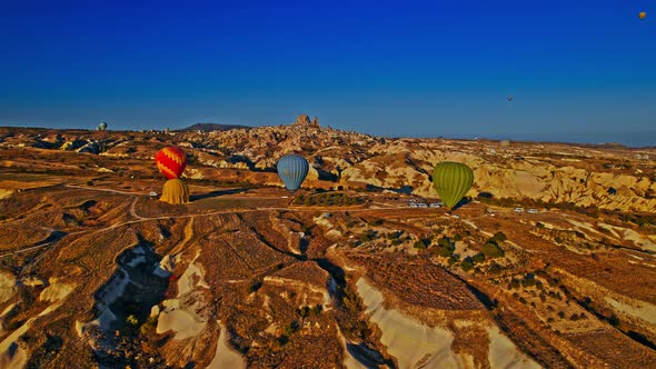 Colorful Hot Air Balloons Flying Over the Valleys