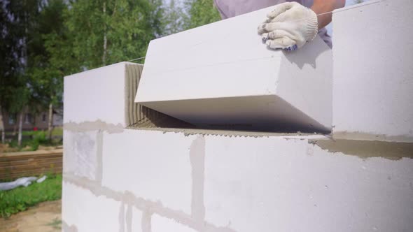 bricklayer, the builder lays bricks or blocks using a stretched rope