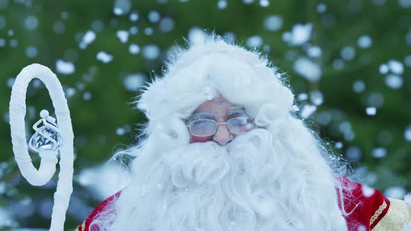 Santa Claus enjoying the snowfall alt