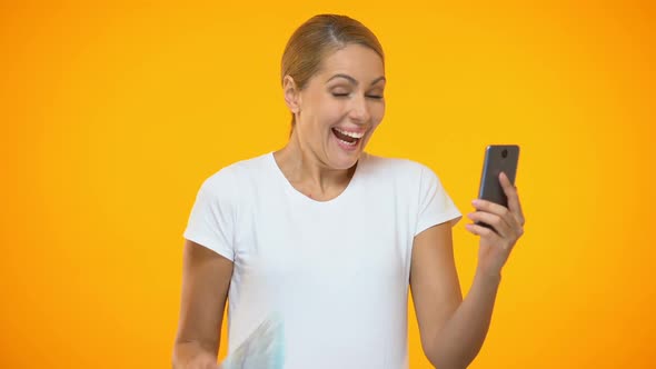 Cheerful Young Female Holding Dollar Bills Using Smartphone Application, Banking