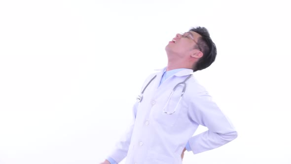 Stressed Young Asian Man Doctor Having Back Pain