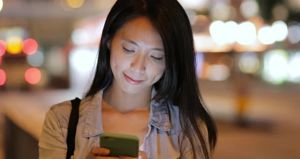 Woman use of cellphone at street