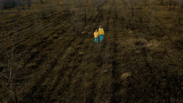 Ukrainian Girls in Clothes in the Colors of the Ukrainian Flag on the Ground