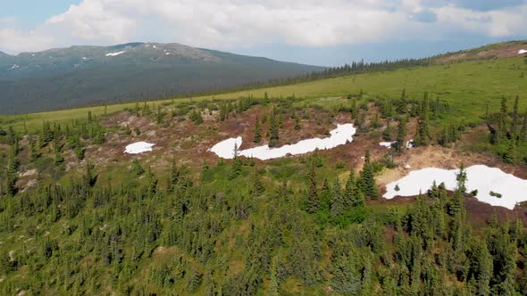 4K Drone Video of Snow Patches on Wickersham Dome in the White Mountains of Alaska on Sunny Summer D