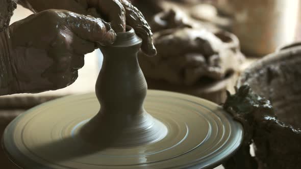 Male Hands Making Ceramic Vase in Pottery Workshop