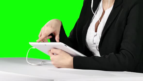 Businesswoman Using Laptop and Headset. Green Screen
