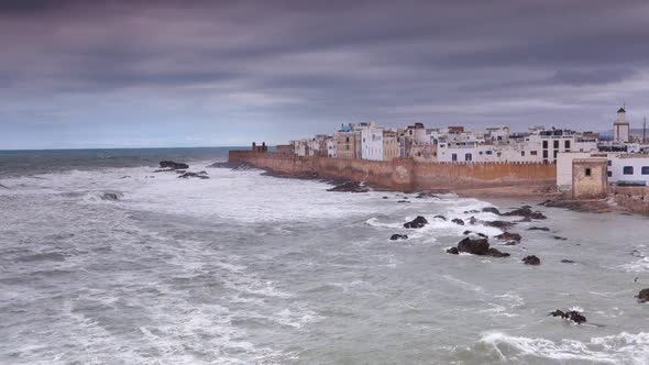Wide angle view from elevated position of the walled castle city of Essaouira, Morocco on a stormy d
