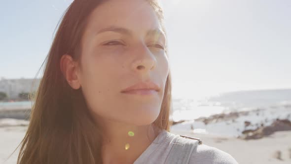 Young woman standing on a beach