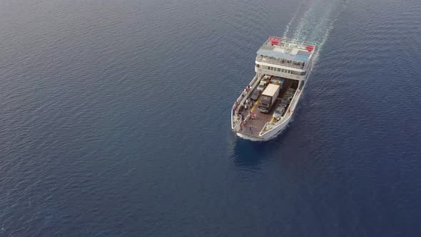 Aerial view of ferry boat with cars in the mediterranean sea, Kosta, Greece.