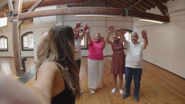 Dance Teacher Taking Selfie with Senior People After Dance Class