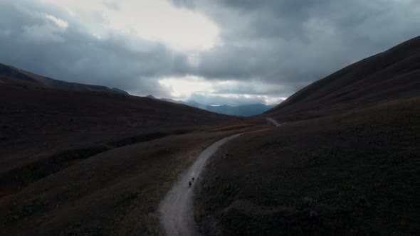 Scenic Aerial Drone Shot of Two Cyclists Traveling