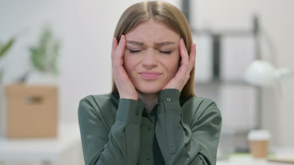 Portrait of Young Woman Having Headache