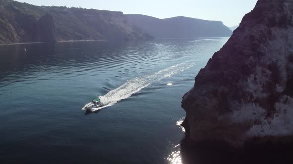 Aerial View From Above on Calm Azure Sea and Volcanic Rocky Shores