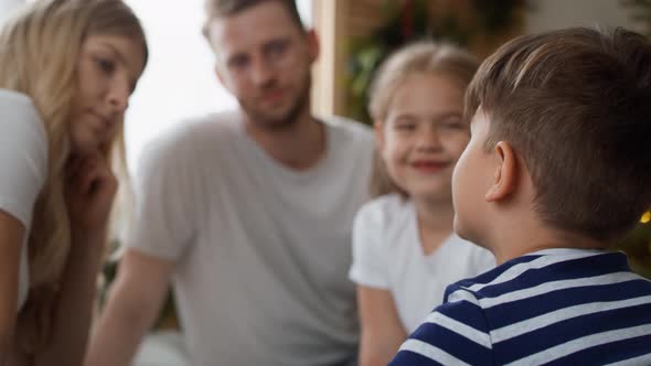 Family spending Christmas morning together in bed. Shot with RED helium camera in 8K