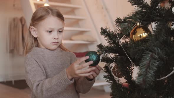 Little Girl Holding Bauble