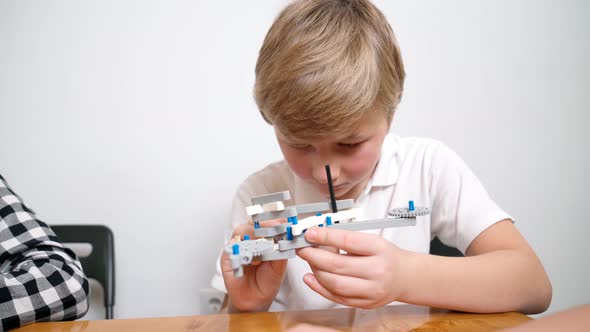 Boy Using Building Kit