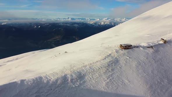 Drone fly over the Snow Mountains and refuge