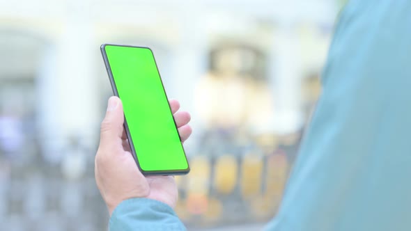 Outdoor Man Watching Smartphone with Green Screen