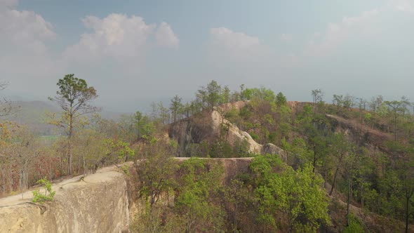 4K Cinematic landscape footage of a serene scenic view of Pai canyon with narrow, ledgy hiking trail