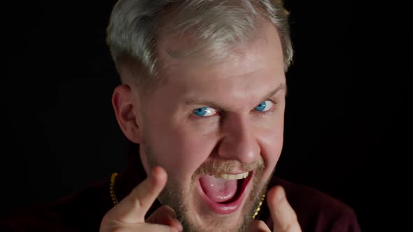 Overjoyed Young Man Wins Competition Achieves Goal and Makes Triumph Gesture Says Yes Shows Fist