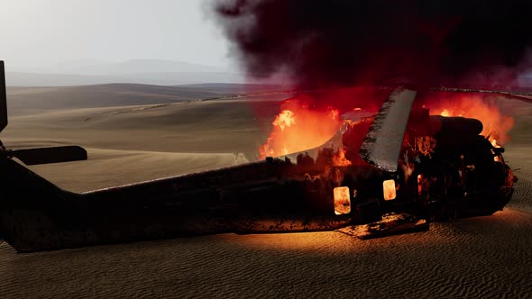 Burned Military Helicopter in the Desert at Sunset alt