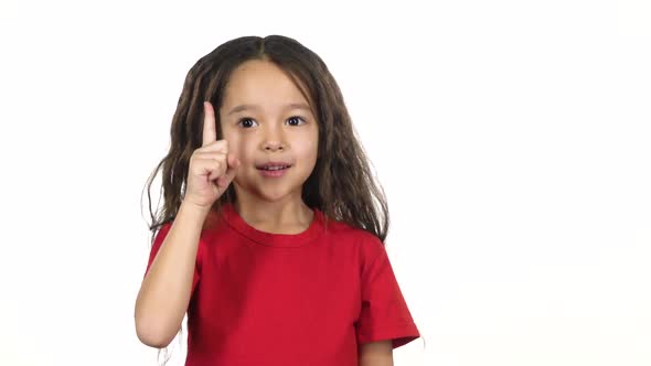 Infant Showing an Idea Then Thumb Up on White Background. Slow Motion