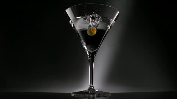 Olive dropped into martini glass, Slow Motion