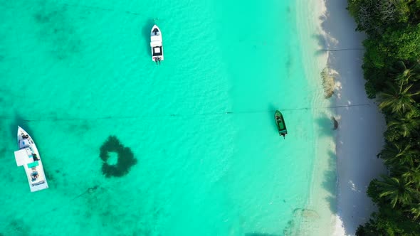 Aerial seascape of idyllic sea view beach trip by blue ocean with white sand background of adventure