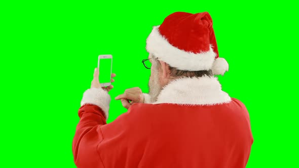 Santa claus using mobile phone