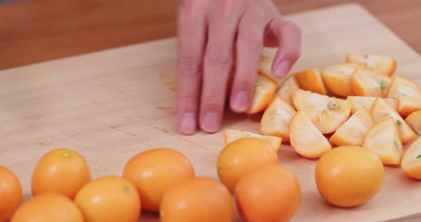 Cut of kumquat by knife