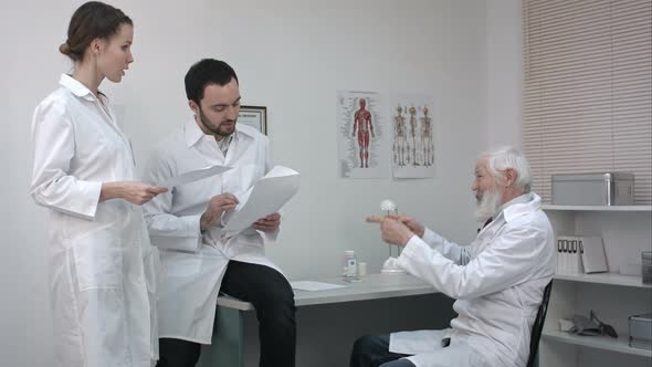 Serious Medical Team Using Discussing Something