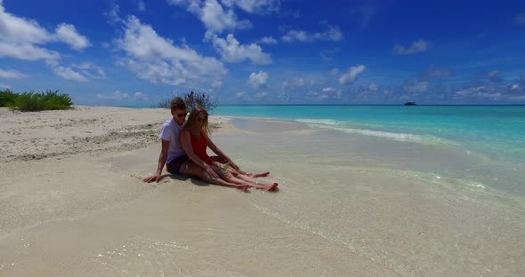 Romantic people on honeymoon vacation spend quality time on beach on paradise white sand background 