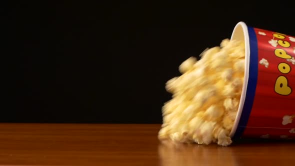 Popcorn in Box Falling and Drop, on Black, Slow Motion