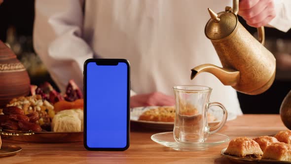 Turkish Sweet Food and Phone with Blue Chroma Key Screen