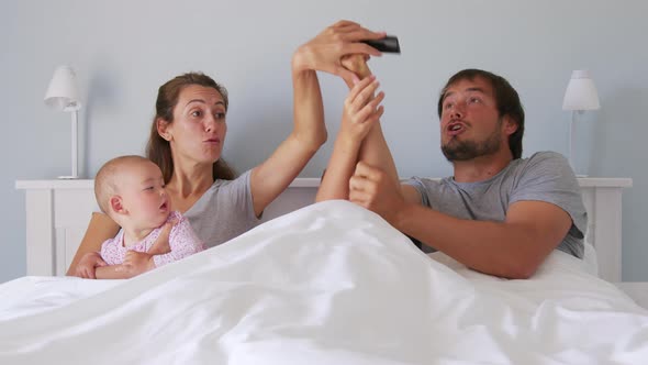 Family Watching Movie at Stylish Apartments