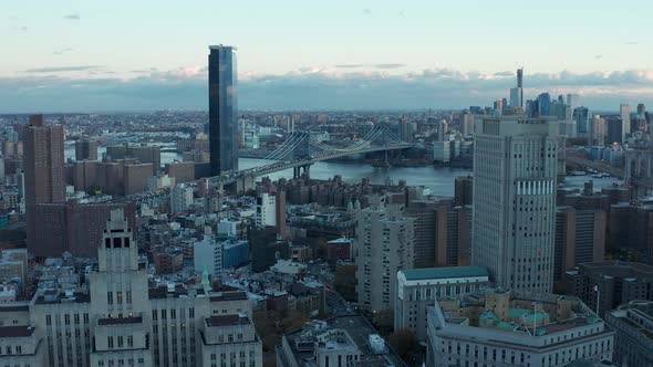 Aerial Descending Shot of Cityscape with Manhattan Bridge