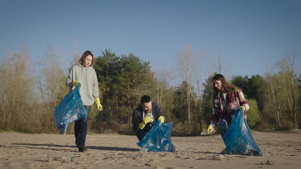 A Team of Volunteers Collects and Sorts Garbage