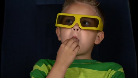 Smiling Little Boy Watching Movie in a Cinema, 3D Glasses, Close Up, Slow Motion