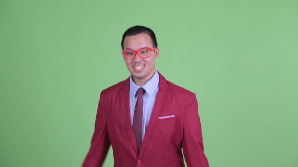 Happy Asian Businessman with Eyeglasses Ready for Valentine's Day