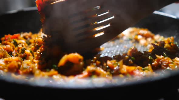 Frying Onions And Carrots On Pan. Closeup.