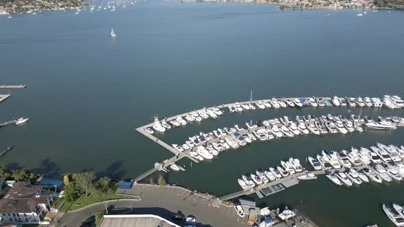 Aerial view of beautiful power and sail boat marina over Sydney Harbour at San Souci featuring boats